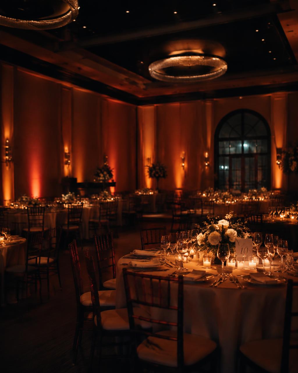 Wedding reception with warm uplighting